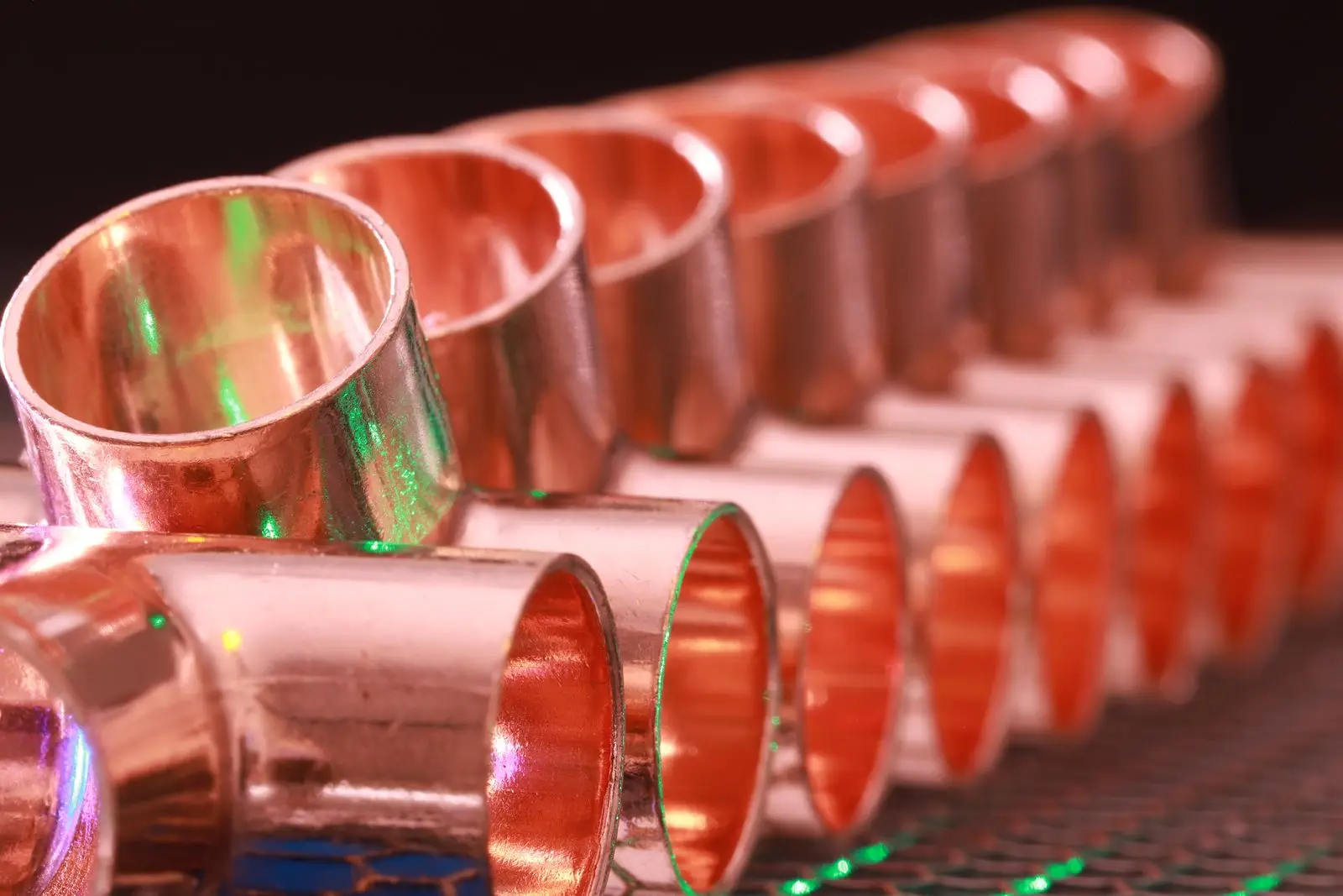Row of copper pipe fittings